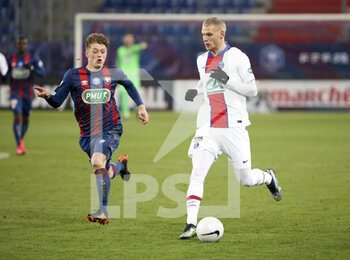 2021-02-10 - Mitchel Bakker of PSG, Johann Lepenant of Caen (left) during the French Cup, round of 64 football match between Stade Malherbe de Caen (SM Caen) and Paris Saint-Germain (PSG) on February 10, 2021 at Stade Michel d'Ornano in Caen, France - Photo Jean Catuffe / DPPI - STADE MALHERBE DE CAEN (SM CAEN) AND PARIS SAINT-GERMAIN (PSG) - FRENCH CUP - SOCCER