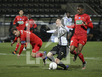 2021-02-11 - Damien Da Silva of Rennes, Pierrick Capelle of Angers, Gerzino Nyamsi of Rennes during the French Cup, round of 64 football match between SCO Angers and Stade Rennais (Rennes) on February 11, 2021 at Stade Raymond Kopa in Angers, France - Photo Jean Catuffe / DPPI - SCO ANGERS AND STADE RENNAIS (RENNES) - FRENCH CUP - SOCCER
