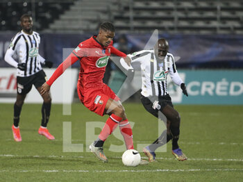 2021-02-11 - Gerzino Nyamsi of Rennes, Sada Thioub of Angers during the French Cup, round of 64 football match between SCO Angers and Stade Rennais (Rennes) on February 11, 2021 at Stade Raymond Kopa in Angers, France - Photo Jean Catuffe / DPPI - SCO ANGERS AND STADE RENNAIS (RENNES) - FRENCH CUP - SOCCER