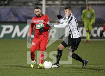 2021-02-11 - Romain Del Castillo of Rennes, Pierrick Capelle of Angers during the French Cup, round of 64 football match between SCO Angers and Stade Rennais (Rennes) on February 11, 2021 at Stade Raymond Kopa in Angers, France - Photo Jean Catuffe / DPPI - SCO ANGERS AND STADE RENNAIS (RENNES) - FRENCH CUP - SOCCER