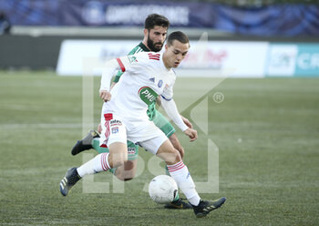 2021-04-08 - Maxence Caqueret of Lyon, Jimmy Roye of Red Star during the French Cup round of 16 football match between Red Star FC and Olympique Lyonnais (OL) on April 8, 2021 at Stade Bauer in Saint-Ouen, France - Photo Jean Catuffe / DPPI - RED STAR FC VS OLYMPIQUE LYONNAIS (OL) - FRENCH CUP - SOCCER