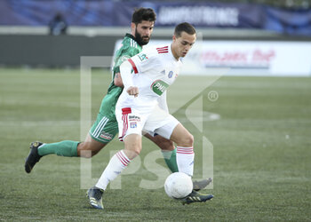 2021-04-08 - Maxence Caqueret of Lyon during the French Cup round of 16 football match between Red Star FC and Olympique Lyonnais (OL) on April 8, 2021 at Stade Bauer in Saint-Ouen, France - Photo Jean Catuffe / DPPI - RED STAR FC VS OLYMPIQUE LYONNAIS (OL) - FRENCH CUP - SOCCER