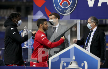 2021-05-19 - Axel Disasi, Kevin Volland of Monaco, President of France Emmanuel Macron, President of French Football Federation FFF Noel Le Graet during the trophy ceremony following the French Cup Final football match between AS Monaco (ASM) and Paris Saint-Germain PSG on May 19, 2021 at Stade de France in Saint-Denis near Paris, France - Photo Jean Catuffe / DPPI - FINAL - AS MONACO (ASM) VS PARIS SAINT-GERMAIN PSG - FRENCH CUP - SOCCER
