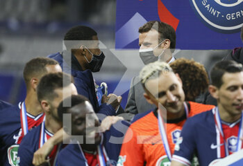 2021-05-19 - President of France Emmanuel Macron salutes Presnel Kimpembe of PSG during the trophy ceremony following the French Cup Final football match between AS Monaco (ASM) and Paris Saint-Germain PSG on May 19, 2021 at Stade de France in Saint-Denis near Paris, France - Photo Jean Catuffe / DPPI - FINAL - AS MONACO (ASM) VS PARIS SAINT-GERMAIN PSG - FRENCH CUP - SOCCER