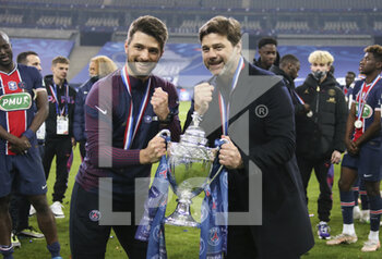 2021-05-19 - Coach of PSG Mauricio Pochettino and his son (left), fitness coach of PSG Sebastiano Pochettino celebrate the victory following the French Cup Final football match between AS Monaco (ASM) and Paris Saint-Germain PSG on May 19, 2021 at Stade de France in Saint-Denis near Paris, France - Photo Jean Catuffe / DPPI - FINAL - AS MONACO (ASM) VS PARIS SAINT-GERMAIN PSG - FRENCH CUP - SOCCER