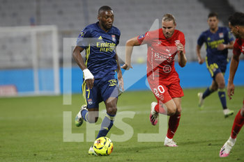 2020-09-18 - Karl TOKO EKAMBI of Lyon and Renaud RIPART of Nimes during the French championship Ligue 1 football match between Olympique Lyonnais and Nimes Olympique on September 18, 2020 at Groupama stadium in Decines-Charpieu near Lyon, France - Photo Romain Biard / Isports / DPPI - OLYMPIQUE LYONNAIS VS NIMES OLYMPIQUE  - FRENCH LIGUE 1 - SOCCER