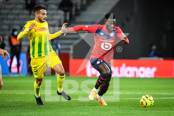 2020-09-25 - Pedro CHIRIVELLA of FC Nantes and Jonathan BAMBA of Lille during the French championship Ligue 1 football match between Lille OSC and FC Nantes on September 25, 2020 at Pierre Mauroy stadium in Villeneuve-d'Ascq near Lille, France - Photo Matthieu Mirville / DPPI - LILLE OSC AND FC NANTES - FRENCH LIGUE 1 - SOCCER