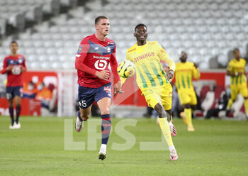 2020-09-25 - Sven Botman of Lille, Randal Kolo Muani of FC Nantes during the French championship Ligue 1 football match between Lille OSC (LOSC) and FC Nantes on September 25, 2020 at Stade Pierre Mauroy in Villeneuve-d'Ascq near Lille, France - Photo Juan Soliz / DPPI - LILLE OSC AND FC NANTES - FRENCH LIGUE 1 - SOCCER