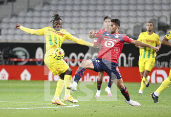 2020-09-25 - Moses Simon of FC Nantes, Mehmet Zeki Celik of Lille during the French championship Ligue 1 football match between Lille OSC (LOSC) and FC Nantes on September 25, 2020 at Stade Pierre Mauroy in Villeneuve-d'Ascq near Lille, France - Photo Juan Soliz / DPPI - LILLE OSC AND FC NANTES - FRENCH LIGUE 1 - SOCCER