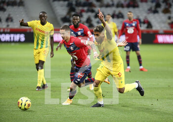 2020-09-25 - Domagoj Bradaric of Lille, Ludovic Blas of FC Nantes during the French championship Ligue 1 football match between Lille OSC (LOSC) and FC Nantes on September 25, 2020 at Stade Pierre Mauroy in Villeneuve-d'Ascq near Lille, France - Photo Juan Soliz / DPPI - LILLE OSC AND FC NANTES - FRENCH LIGUE 1 - SOCCER