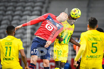 2020-09-25 - Burak YILMAZ of Lille and Dennis APPIAH of FC Nantes during the French championship Ligue 1 football match between Lille OSC and FC Nantes on September 25, 2020 at Pierre Mauroy stadium in Villeneuve-d'Ascq near Lille, France - Photo Matthieu Mirville / DPPI - LILLE OSC AND FC NANTES - FRENCH LIGUE 1 - SOCCER
