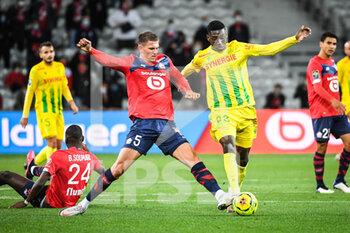 2020-09-25 - Sven BOTMAN of Lille and Randal KOLO MUANI of FC Nantes during the French championship Ligue 1 football match between Lille OSC and FC Nantes on September 25, 2020 at Pierre Mauroy stadium in Villeneuve-d'Ascq near Lille, France - Photo Matthieu Mirville / DPPI - LILLE OSC AND FC NANTES - FRENCH LIGUE 1 - SOCCER