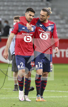 2020-09-25 - Mehmet Zeki Celik, Yusuf Yazici of Lille celebrate the victory following the French championship Ligue 1 football match between Lille OSC (LOSC) and FC Nantes on September 25, 2020 at Stade Pierre Mauroy in Villeneuve-d'Ascq near Lille, France - Photo Juan Soliz / DPPI - LILLE OSC AND FC NANTES - FRENCH LIGUE 1 - SOCCER