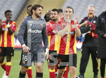 2020-10-03 - Goalkeeper of Lens Jean-Louis Leca, Yannick Cahuzac of Lens and teammates celebrate the victory following the French championship Ligue 1 football match between RC Lens and AS Saint Etienne (ASSE) on October 3, 2020 at Stade Bollaert-Delelis formerly Stade Felix Bollaert in Lens, France - Photo Jean Catuffe / DPPI - RC LENS VS AS SAINT ETIENNE (ASSE) - FRENCH LIGUE 1 - SOCCER