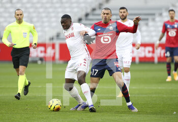 2020-12-06 - Youssouf Fofana of Monaco, Burak Yilmaz of Lille during the French championship Ligue 1 football match between Lille OSC and AS Monaco on December 6, 2020 at Stade Pierre Mauroy in Villeneuve-d'Ascq near Lille, France - Photo Jean Catuffe / DPPI - LILLE OSC VS AS MONACO - FRENCH LIGUE 1 - SOCCER