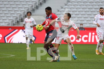 2020-12-06 - Duel Jonathan DAVID 8 LOSC forn Ruben Aguilar AS Monaco during the French championship Ligue 1 football match between Lille OSC and AS Monaco on December 6, 2020 at Pierre Mauroy stadium in Villeneuve-d'Ascq, France - Photo Laurent Sanson / LS Medianord / DPPI - LILLE OSC VS AS MONACO - FRENCH LIGUE 1 - SOCCER