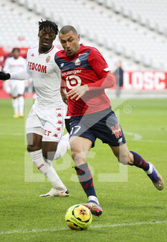 2020-12-06 - Burak Yilmaz of Lille, Axel Disasi of Monaco (left) during the French championship Ligue 1 football match between Lille OSC and AS Monaco on December 6, 2020 at Stade Pierre Mauroy in Villeneuve-d'Ascq near Lille, France - Photo Jean Catuffe / DPPI - LILLE OSC VS AS MONACO - FRENCH LIGUE 1 - SOCCER
