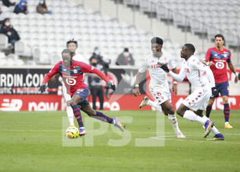 2020-12-06 - Jonathan Ikone of Lille, Aurelien Tchouameni, Youssouf Fofana of Monaco during the French championship Ligue 1 football match between Lille OSC and AS Monaco on December 6, 2020 at Stade Pierre Mauroy in Villeneuve-d'Ascq near Lille, France - Photo Jean Catuffe / DPPI - LILLE OSC VS AS MONACO - FRENCH LIGUE 1 - SOCCER
