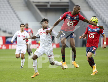 2020-12-06 - Gelson Martins of Monaco, Tiago Djalo of Lille during the French championship Ligue 1 football match between Lille OSC and AS Monaco on December 6, 2020 at Stade Pierre Mauroy in Villeneuve-d'Ascq near Lille, France - Photo Jean Catuffe / DPPI - LILLE OSC VS AS MONACO - FRENCH LIGUE 1 - SOCCER