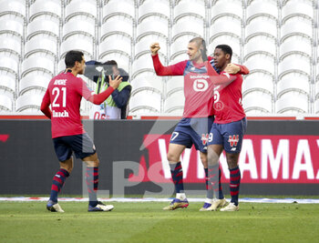 2020-12-06 - Jonathan David of Lille celebrates his goal with Benjamin Andre, Burak Yilmaz during the French championship Ligue 1 football match between Lille OSC and AS Monaco on December 6, 2020 at Stade Pierre Mauroy in Villeneuve-d'Ascq near Lille, France - Photo Jean Catuffe / DPPI - LILLE OSC VS AS MONACO - FRENCH LIGUE 1 - SOCCER