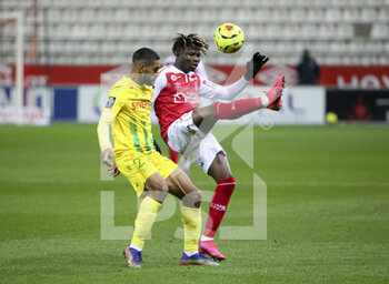 2020-12-16 - El Bilal Toure of Reims, Jean-Charles Castelletto of FC Nantes (left) during the French championship Ligue 1 football match between Stade de Reims and FC Nantes on December 16, 2020 at Stade Auguste Delaune in Reims, France - Photo Jean Catuffe / DPPI - STADE DE REIMS VS FC NANTES - FRENCH LIGUE 1 - SOCCER