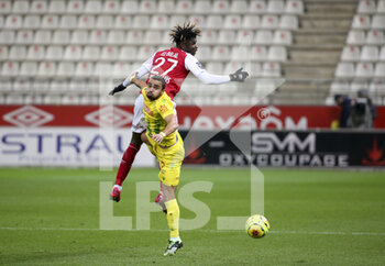 2020-12-16 - Fabio Da Silva of FC Nantes, El Bilal Toure of Reims during the French championship Ligue 1 football match between Stade de Reims and FC Nantes on December 16, 2020 at Stade Auguste Delaune in Reims, France - Photo Jean Catuffe / DPPI - STADE DE REIMS VS FC NANTES - FRENCH LIGUE 1 - SOCCER