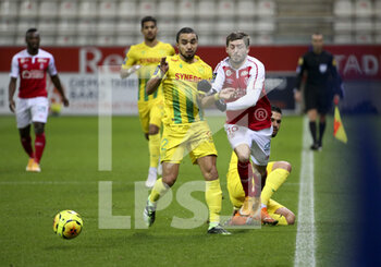 2020-12-16 - Fabio Da Silva of FC Nantes, Arber Zeneli of Reims during the French championship Ligue 1 football match between Stade de Reims and FC Nantes on December 16, 2020 at Stade Auguste Delaune in Reims, France - Photo Jean Catuffe / DPPI - STADE DE REIMS VS FC NANTES - FRENCH LIGUE 1 - SOCCER