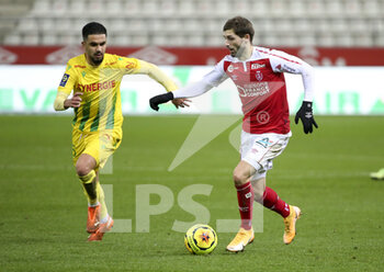 2020-12-16 - Arber Zeneli of Reims, Imran Louza of FC Nantes during the French championship Ligue 1 football match between Stade de Reims and FC Nantes on December 16, 2020 at Stade Auguste Delaune in Reims, France - Photo Jean Catuffe / DPPI - STADE DE REIMS VS FC NANTES - FRENCH LIGUE 1 - SOCCER