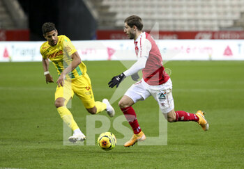 2020-12-16 - Arber Zeneli of Reims, Ludovic Blas of FC Nantes (left) during the French championship Ligue 1 football match between Stade de Reims and FC Nantes on December 16, 2020 at Stade Auguste Delaune in Reims, France - Photo Jean Catuffe / DPPI - STADE DE REIMS VS FC NANTES - FRENCH LIGUE 1 - SOCCER