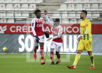 2020-12-16 - El Bilal Toure of Reims celebrates his goal with Moreto Cassama during the French championship Ligue 1 football match between Stade de Reims and FC Nantes on December 16, 2020 at Stade Auguste Delaune in Reims, France - Photo Jean Catuffe / DPPI - STADE DE REIMS VS FC NANTES - FRENCH LIGUE 1 - SOCCER