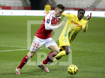 2020-12-16 - Thomas Foket of Reims, Abdoul Kader Bamba of FC Nantes during the French championship Ligue 1 football match between Stade de Reims and FC Nantes on December 16, 2020 at Stade Auguste Delaune in Reims, France - Photo Jean Catuffe / DPPI - STADE DE REIMS VS FC NANTES - FRENCH LIGUE 1 - SOCCER