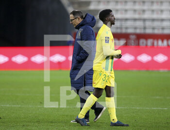 2020-12-16 - Newly named coach of FC Nantes Patrick Collot, Abdoul Kader Bamba of FC Nantes following the French championship Ligue 1 football match between Stade de Reims and FC Nantes on December 16, 2020 at Stade Auguste Delaune in Reims, France - Photo Jean Catuffe / DPPI - STADE DE REIMS VS FC NANTES - FRENCH LIGUE 1 - SOCCER