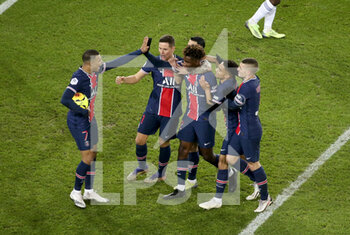 2020-12-23 - Timothee Pembele of PSG (center) celebrates his goal with Kylian Mbappe (left) and teammates during the French championship Ligue 1 football match between Paris Saint-Germain (PSG) and RC Strasbourg on December 23, 2020 at Parc des Princes stadium in Paris, France - Photo Jean Catuffe / DPPI - PARIS SAINT-GERMAIN (PSG) VS RC STRASBOURG - FRENCH LIGUE 1 - SOCCER