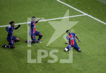 2020-12-23 - Idrissa Gueye Gana of PSG (right) celebrates his goal with Timothee Pembele, Moise Kean during the French championship Ligue 1 football match between Paris Saint-Germain (PSG) and RC Strasbourg on December 23, 2020 at Parc des Princes stadium in Paris, France - Photo Jean Catuffe / DPPI - PARIS SAINT-GERMAIN (PSG) VS RC STRASBOURG - FRENCH LIGUE 1 - SOCCER