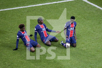 2020-12-23 - Idrissa Gueye Gana of PSG (right) celebrates his goal with Timothee Pembele, Moise Kean during the French championship Ligue 1 football match between Paris Saint-Germain (PSG) and RC Strasbourg on December 23, 2020 at Parc des Princes stadium in Paris, France - Photo Jean Catuffe / DPPI - PARIS SAINT-GERMAIN (PSG) VS RC STRASBOURG - FRENCH LIGUE 1 - SOCCER