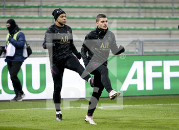 2021-01-06 - Marco Verratti, Kylian Mbappe (left) of PSG warm up before the French championship Ligue 1 football match between AS Saint-Etienne (ASSE) and Paris Saint-Germain (PSG) on January 6, 2021 at stade Geoffroy Guichard in Saint-Etienne, France - Photo Jean Catuffe / DPPI - AS SAINT-ETIENNE (ASSE) VS PARIS SAINT-GERMAIN (PSG) - FRENCH LIGUE 1 - SOCCER
