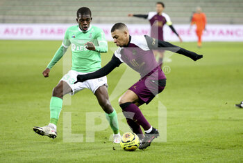 2021-01-06 - Kylian Mbappe of PSG, Lucas Gourna-Douath of Saint-Etienne (left) during the French championship Ligue 1 football match between AS Saint-Etienne (ASSE) and Paris Saint-Germain (PSG) on January 6, 2021 at stade Geoffroy Guichard in Saint-Etienne, France - Photo Jean Catuffe / DPPI - AS SAINT-ETIENNE (ASSE) VS PARIS SAINT-GERMAIN (PSG) - FRENCH LIGUE 1 - SOCCER