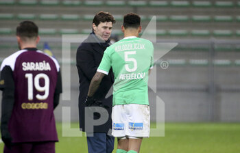 2021-01-06 - Coach of PSG Mauricio Pochettino salutes Thimotee Kolodziejczak of Saint-Etienne following the French championship Ligue 1 football match between AS Saint-Etienne (ASSE) and Paris Saint-Germain (PSG) on January 6, 2021 at stade Geoffroy Guichard in Saint-Etienne, France - Photo Jean Catuffe / DPPI - AS SAINT-ETIENNE (ASSE) VS PARIS SAINT-GERMAIN (PSG) - FRENCH LIGUE 1 - SOCCER