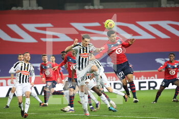 2021-01-06 - Duel on the air Benjamin Andre 21 LOSC and Pierrick Capelle 15 Angers during the French championship Ligue 1 football match between Lille OSC and Angers SCO on January 6, 2021 at Pierre Mauroy stadium in Villeneuve-d'Ascq near Lille, France - Photo Laurent Sanson / LS Medianord / DPPI - LILLE OSC VS ANGERS SCO - FRENCH LIGUE 1 - SOCCER