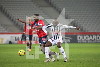 2021-01-06 - Duel Soumare 24 LOSC and Bahoken 19 Angers during the French championship Ligue 1 football match between Lille OSC and Angers SCO on January 6, 2021 at Pierre Mauroy stadium in Villeneuve-d'Ascq near Lille, France - Photo Laurent Sanson / LS Medianord / DPPI - LILLE OSC VS ANGERS SCO - FRENCH LIGUE 1 - SOCCER