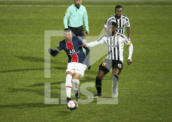 2021-01-16 - Kylian Mbappe of PSG, Ismael Traore of Angers during the French championship Ligue 1 football match between Angers SCO and Paris Saint-Germain on January 16, 2021 at Stade Raymond Kopa in Angers, France - Photo Jean Catuffe / DPPI - ANGERS SCO AND PARIS SAINT-GERMAIN - FRENCH LIGUE 1 - SOCCER
