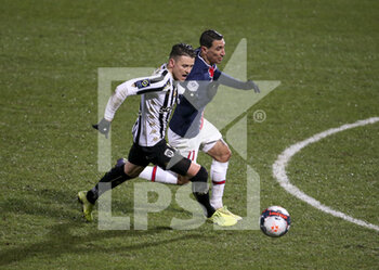 2021-01-16 - Pierrick Capelle of Angers, Angel Di Maria of PSG during the French championship Ligue 1 football match between Angers SCO and Paris Saint-Germain on January 16, 2021 at Stade Raymond Kopa in Angers, France - Photo Jean Catuffe / DPPI - ANGERS SCO AND PARIS SAINT-GERMAIN - FRENCH LIGUE 1 - SOCCER