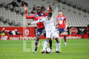 2021-01-17 - Duel MBUKU 21 Reims and IKONE 10 LOSC during the French championship Ligue 1 football match between Lille OSC and Stade de Reims on January 17, 2021 at Pierre Mauroy stadium in Villeneuve-d'Ascq near Lille, France - Photo Laurent Sanson / LS Medianord / DPPI - LILLE OSC AND STADE DE REIMS - FRENCH LIGUE 1 - SOCCER