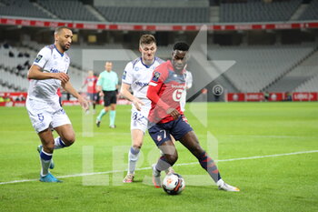2021-01-17 - Bamba 7 LOSC and FOKET 32 Reims during the French championship Ligue 1 football match between Lille OSC and Stade de Reims on January 17, 2021 at Pierre Mauroy stadium in Villeneuve-d'Ascq near Lille, France - Photo Laurent Sanson / LS Medianord / DPPI - LILLE OSC AND STADE DE REIMS - FRENCH LIGUE 1 - SOCCER