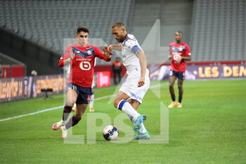 2021-01-17 - ARAUJO 11 LOSC and captain ABDELHAMID 5 Reims during the French championship Ligue 1 football match between Lille OSC and Stade de Reims on January 17, 2021 at Pierre Mauroy stadium in Villeneuve-d'Ascq near Lille, France - Photo Laurent Sanson / LS Medianord / DPPI - LILLE OSC AND STADE DE REIMS - FRENCH LIGUE 1 - SOCCER