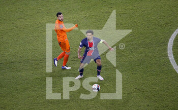 2021-01-22 - Marquinhos of PSG, Teji Savanier of Montpellier (left) during the French championship Ligue 1 football match between Paris Saint-Germain (PSG) and Montpellier HSC (MHSC) on January 22, 2021 at Parc des Princes stadium in Paris, France - Photo Jean Catuffe / DPPI - PARIS SAINT-GERMAIN (PSG) AND MONTPELLIER HSC (MHSC) - FRENCH LIGUE 1 - SOCCER
