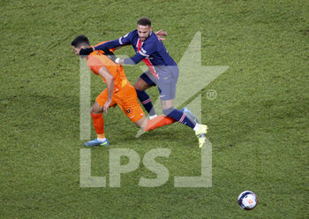 2021-01-22 - Neymar Jr of PSG, Pedro Mendes of Montpellier (left) during the French championship Ligue 1 football match between Paris Saint-Germain (PSG) and Montpellier HSC (MHSC) on January 22, 2021 at Parc des Princes stadium in Paris, France - Photo Jean Catuffe / DPPI - PARIS SAINT-GERMAIN (PSG) AND MONTPELLIER HSC (MHSC) - FRENCH LIGUE 1 - SOCCER