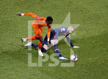 2021-01-22 - Junior Sambia of Montpellier, Layvin Kurzawa of PSG during the French championship Ligue 1 football match between Paris Saint-Germain (PSG) and Montpellier HSC (MHSC) on January 22, 2021 at Parc des Princes stadium in Paris, France - Photo Jean Catuffe / DPPI - PARIS SAINT-GERMAIN (PSG) AND MONTPELLIER HSC (MHSC) - FRENCH LIGUE 1 - SOCCER