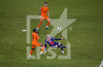 2021-01-22 - Layvin Kurzawa of PSG, Stephy Mavididi of Montpellier (left), Pedro Mendes of Montpellier (top) during the French championship Ligue 1 football match between Paris Saint-Germain (PSG) and Montpellier HSC (MHSC) on January 22, 2021 at Parc des Princes stadium in Paris, France - Photo Jean Catuffe / DPPI - PARIS SAINT-GERMAIN (PSG) AND MONTPELLIER HSC (MHSC) - FRENCH LIGUE 1 - SOCCER