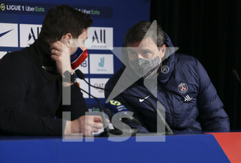 2021-01-22 - Coach of PSG Mauricio Pochettino - helped by his assistant coach Michel D'Agostino as translator - answers to the media during the post-match press conference following the French championship Ligue 1 football match between Paris Saint-Germain (PSG) and Montpellier HSC (MHSC) on January 22, 2021 at Parc des Princes stadium in Paris, France - Photo Jean Catuffe / DPPI - PARIS SAINT-GERMAIN (PSG) AND MONTPELLIER HSC (MHSC) - FRENCH LIGUE 1 - SOCCER